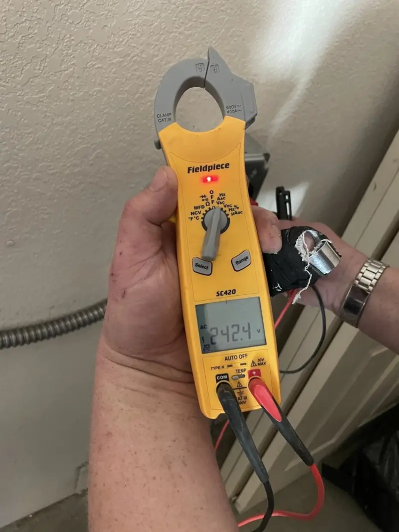 Voltage testing with clamp meter during Ceiling Fan Installation in Fox Point